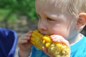 Child Eating Corn Cob
